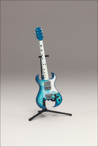 Illustration for article titled McFarlane's Tiny, Plastic Guitar Hero Guitars